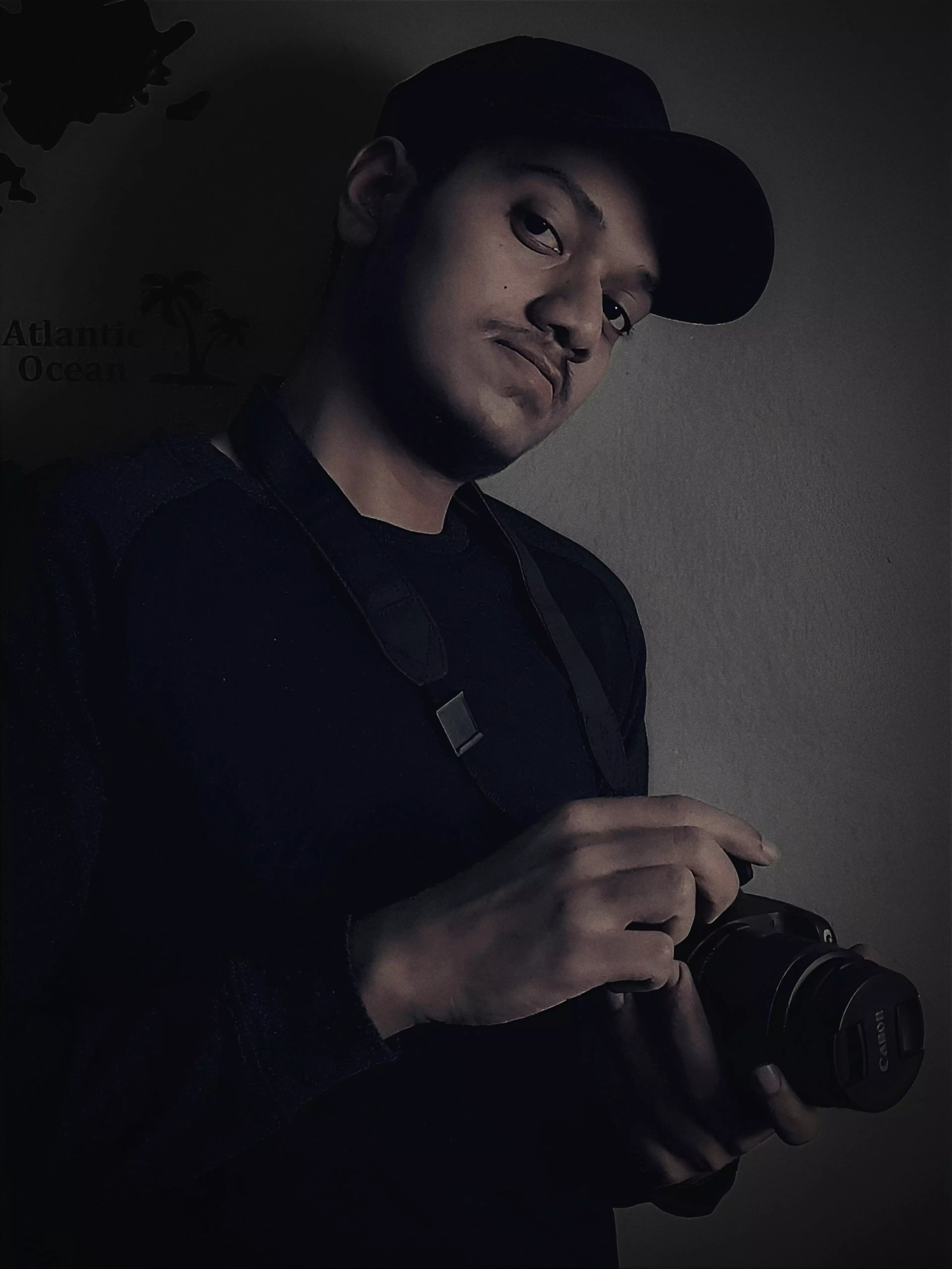 portrait image of Sahil Mondal holding a camera